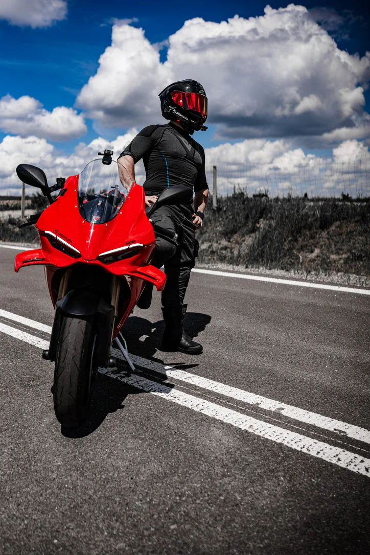 DDXMoto standing beside a red Ducati Panigale